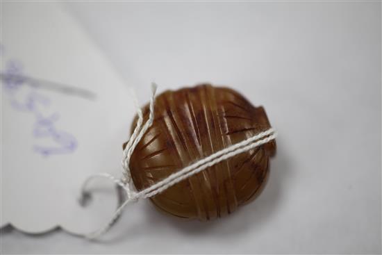 A Chinese yellow chalcedony bead, 19th century, 2.6cm